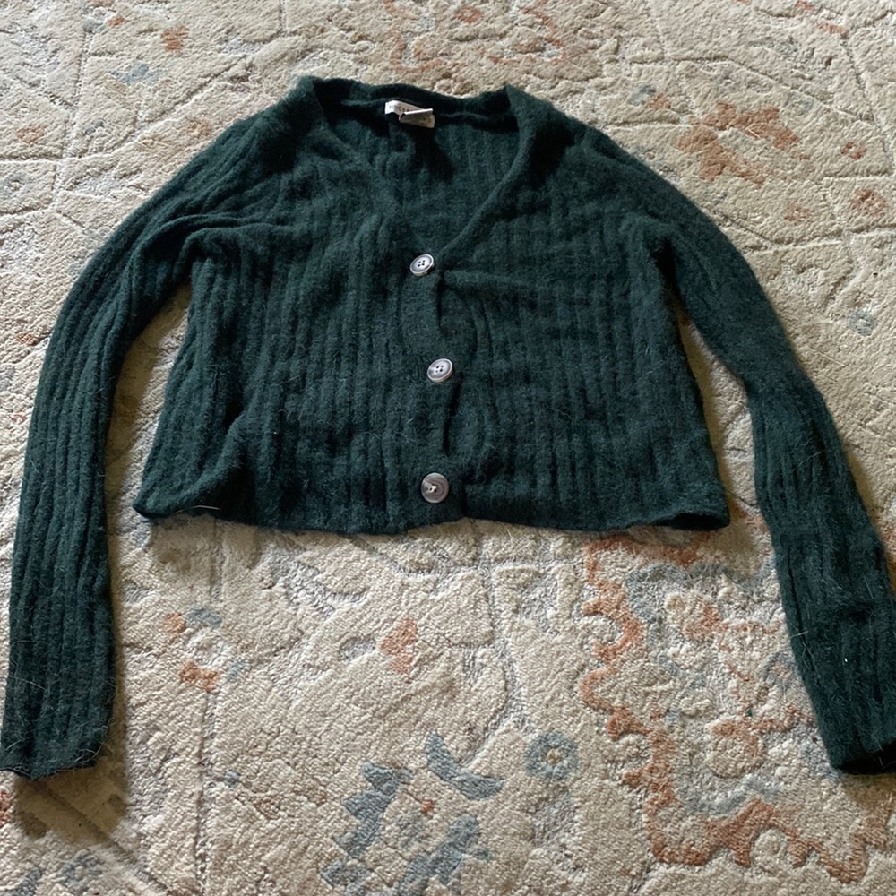 Green sweater top.
